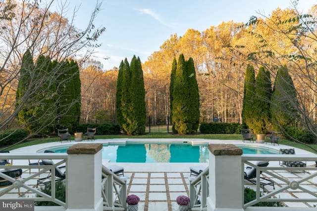  - swimming pool with a patio and a jacuzzi