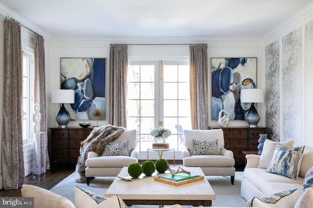  - living room featuring healthy amount of natural light, wood finished floors, and crown molding