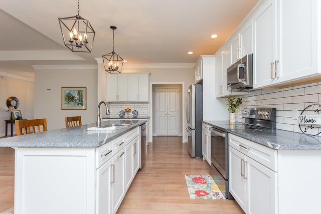33 Silver Maple Cv, Fishersville, VA 22939 - kitchen featuring appliances with stainless steel finishes, a sink, recessed lighting, backsplash, and white cabinets