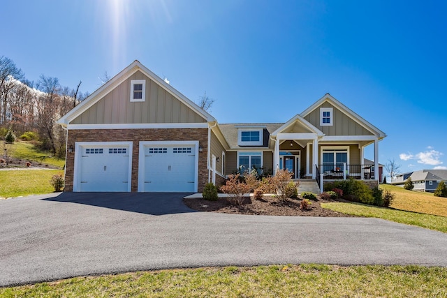 33 Silver Maple Cv, Fishersville, VA 22939 - view of front of property featuring board and batten siding, driveway, covered porch, and stone siding