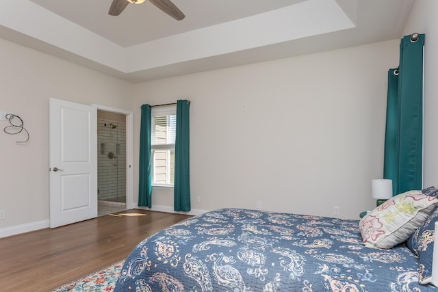 33 Silver Maple Cv, Fishersville, VA 22939 - bedroom featuring wood finished floors, a tray ceiling, baseboards, ceiling fan, and ensuite bath