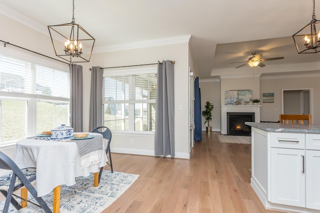 33 Silver Maple Cv, Fishersville, VA 22939 - dining room featuring a chandelier, a fireplace with flush hearth, light wood finished floors, baseboards, and ceiling fan