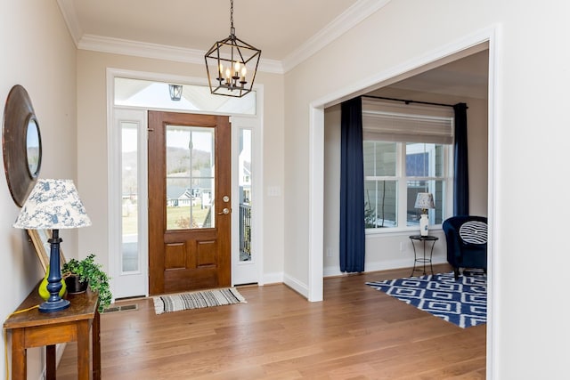 33 Silver Maple Cv, Fishersville, VA 22939 - foyer with wood finished floors, crown molding, a chandelier, healthy amount of natural light, and baseboards