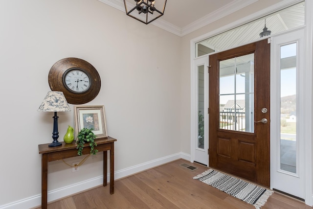 33 Silver Maple Cv, Fishersville, VA 22939 - foyer with a chandelier, crown molding, wood finished floors, and baseboards