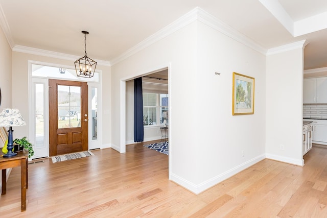 33 Silver Maple Cv, Fishersville, VA 22939 - entryway with light wood finished floors, plenty of natural light, a chandelier, baseboards, and ornamental molding