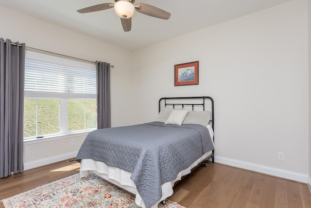 33 Silver Maple Cv, Fishersville, VA 22939 - bedroom with baseboards, wood finished floors, and a ceiling fan