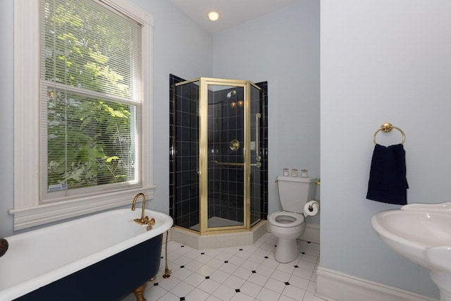557 Wayne Ave S, Waynesboro, VA 22980 - bathroom featuring a soaking tub, toilet, a shower stall, tile patterned floors, and baseboards