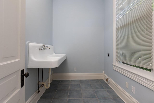 557 Wayne Ave S, Waynesboro, VA 22980 - bathroom featuring tile patterned flooring, baseboards, and a sink