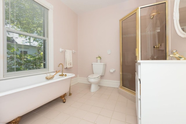 557 Wayne Ave S, Waynesboro, VA 22980 - bathroom featuring a soaking tub, a shower stall, tile patterned flooring, toilet, and vanity