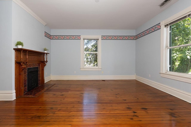 557 Wayne Ave S, Waynesboro, VA 22980 - unfurnished living room featuring plenty of natural light, hardwood / wood-style flooring, baseboards, and a brick fireplace