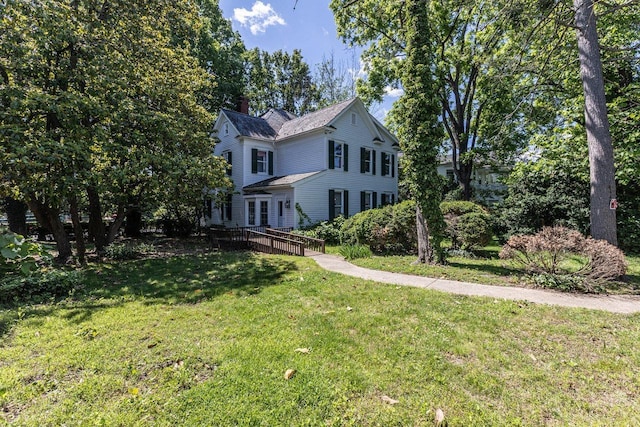 557 Wayne Ave S, Waynesboro, VA 22980 - traditional home featuring a chimney, a front lawn, and a deck