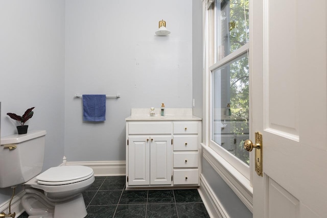 557 Wayne Ave S, Waynesboro, VA 22980 - bathroom with toilet, vanity, and baseboards
