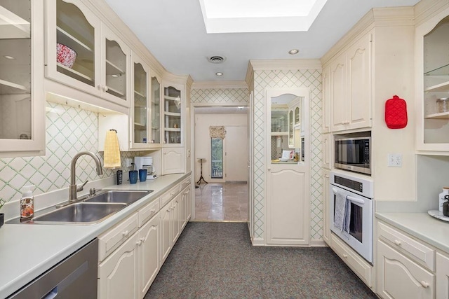 188 Middlebrook Rd, Staunton, VA 24401 - kitchen featuring appliances with stainless steel finishes, a sink, a skylight, light countertops, and crown molding