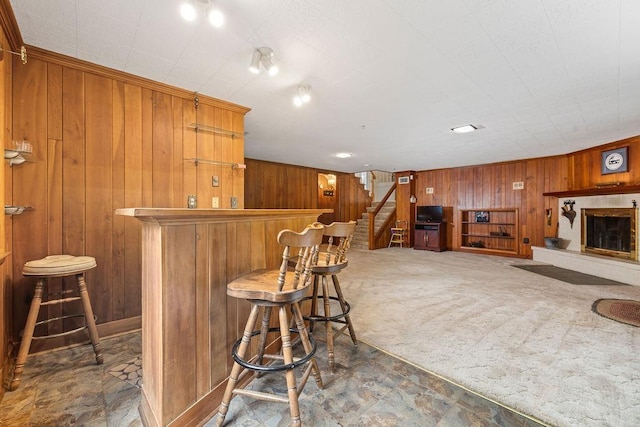 188 Middlebrook Rd, Staunton, VA 24401 - indoor dry bar with wooden walls, stairs, carpet floors, and a fireplace with raised hearth