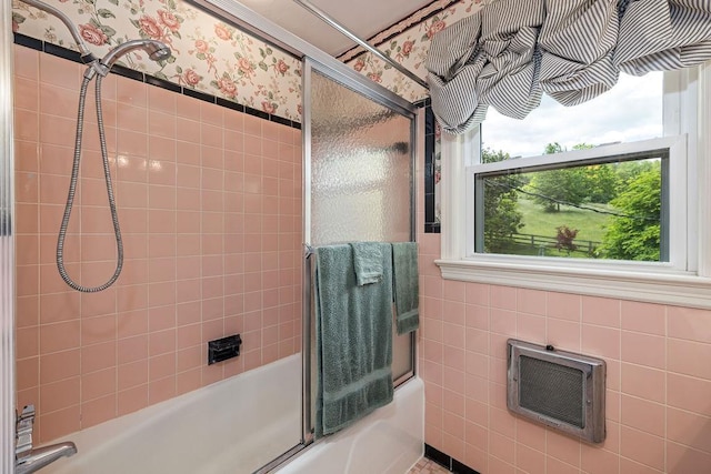 188 Middlebrook Rd, Staunton, VA 24401 - full bath featuring wallpapered walls, combined bath / shower with glass door, heating unit, and tile walls