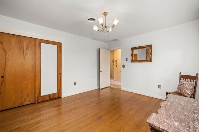 188 Middlebrook Rd, Staunton, VA 24401 - unfurnished bedroom featuring baseboards, light wood-type flooring, and a chandelier