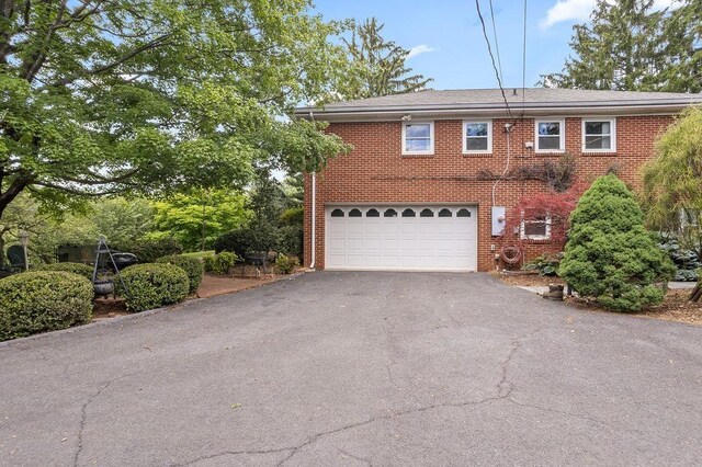 188 Middlebrook Rd, Staunton, VA 24401 - view of front facade featuring asphalt driveway, a garage, and brick siding