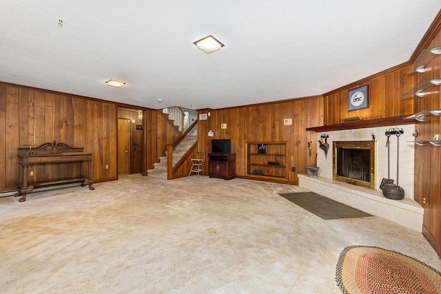 188 Middlebrook Rd, Staunton, VA 24401 - unfurnished living room featuring wooden walls, stairway, light colored carpet, a brick fireplace, and ornamental molding