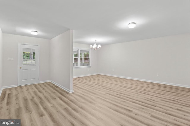 447 Laurel Ave, Fredericksburg, VA 22408 - foyer entrance with a chandelier, healthy amount of natural light, light wood-style floors, and baseboards