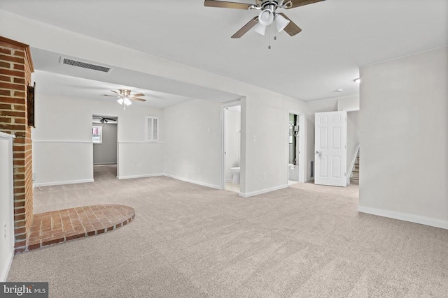 447 Laurel Ave, Fredericksburg, VA 22408 - unfurnished living room featuring a ceiling fan, carpet floors, baseboards, and stairs