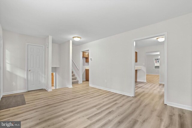 447 Laurel Ave, Fredericksburg, VA 22408 - spare room with light wood-type flooring, baseboards, and stairs