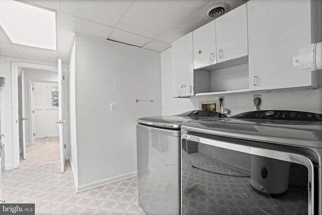447 Laurel Ave, Fredericksburg, VA 22408 - laundry room featuring cabinet space, washing machine and dryer, baseboards, and light floors