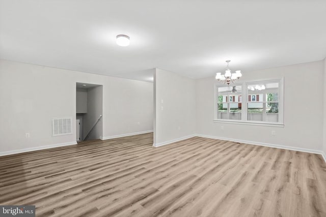 447 Laurel Ave, Fredericksburg, VA 22408 - unfurnished room featuring wood finished floors, a chandelier, and baseboards