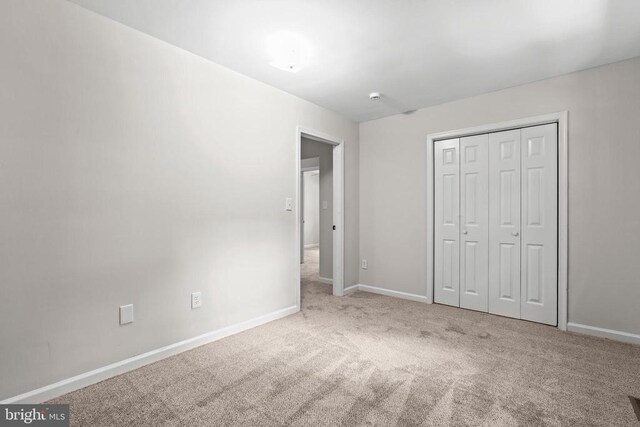 447 Laurel Ave, Fredericksburg, VA 22408 - unfurnished bedroom with carpet flooring, baseboards, and a closet