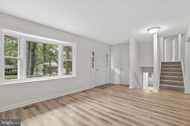 447 Laurel Ave, Fredericksburg, VA 22408 - entrance foyer with light wood finished floors, stairway, and baseboards