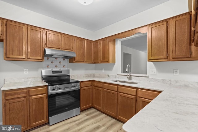 447 Laurel Ave, Fredericksburg, VA 22408 - kitchen featuring under cabinet range hood, electric range, a sink, and light countertops