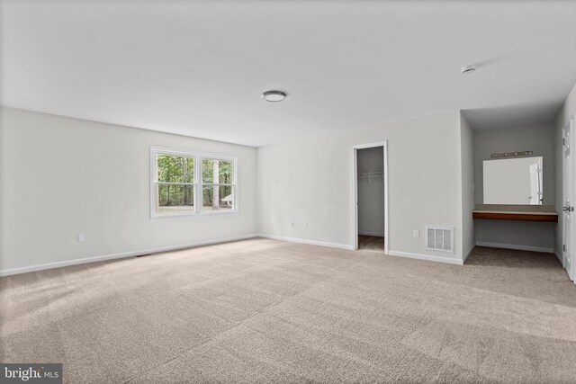 447 Laurel Ave, Fredericksburg, VA 22408 - unfurnished bedroom featuring carpet floors, baseboards, a walk in closet, and a closet