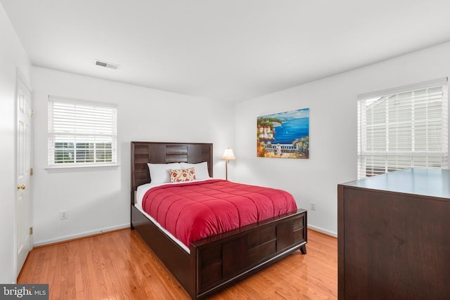 5502 Joshua Tree Cir, Fredericksburg, VA 22407 - bedroom featuring baseboards, light wood finished floors, and visible vents