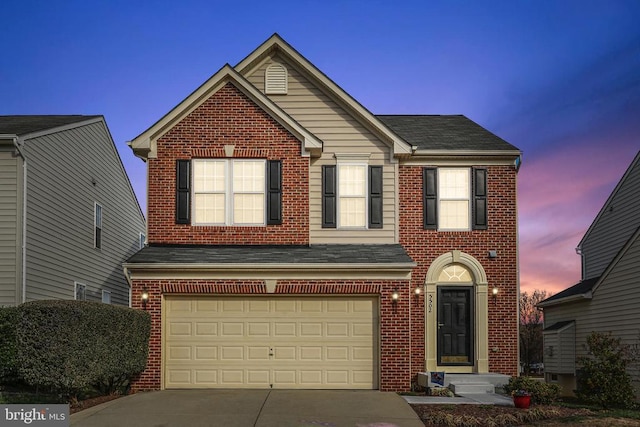 5502 Joshua Tree Cir, Fredericksburg, VA 22407 - traditional-style house featuring brick siding, driveway, a garage, and roof with shingles