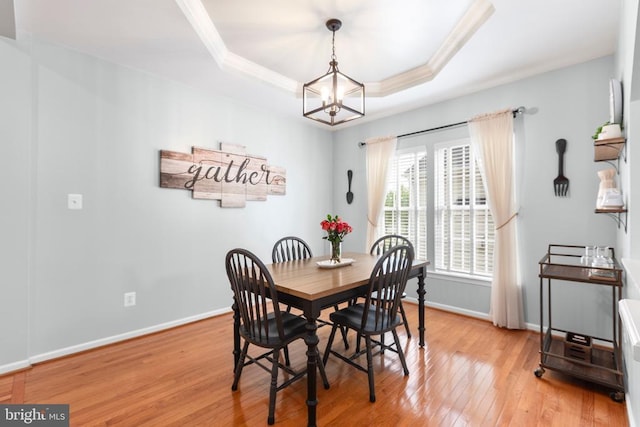 5502 Joshua Tree Cir, Fredericksburg, VA 22407 - dining area featuring a chandelier, light wood-style floors, crown molding, baseboards, and a tray ceiling