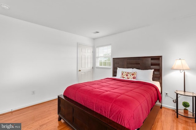 5502 Joshua Tree Cir, Fredericksburg, VA 22407 - bedroom with baseboards, visible vents, and wood finished floors