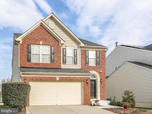 5502 Joshua Tree Cir, Fredericksburg, VA 22407 - view of front of house with concrete driveway, an attached garage, a shingled roof, and brick siding