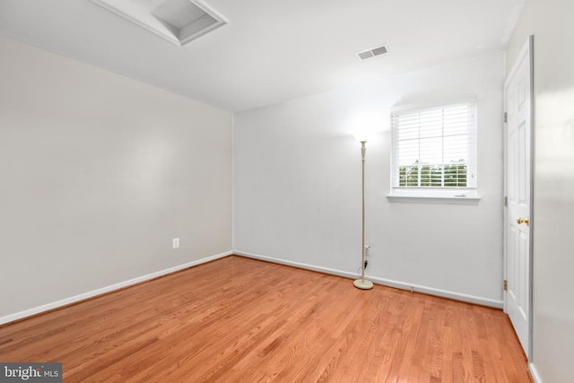 5502 Joshua Tree Cir, Fredericksburg, VA 22407 - empty room featuring baseboards, attic access, visible vents, and wood finished floors