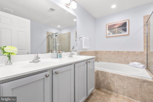 5502 Joshua Tree Cir, Fredericksburg, VA 22407 - bathroom featuring a stall shower, visible vents, a sink, and double vanity
