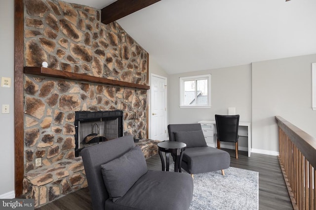 living room with dark wood-style floors, a stone fireplace, and baseboards