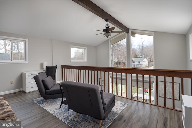 sitting room with plenty of natural light, a ceiling fan, baseboards, and wood finished floors
