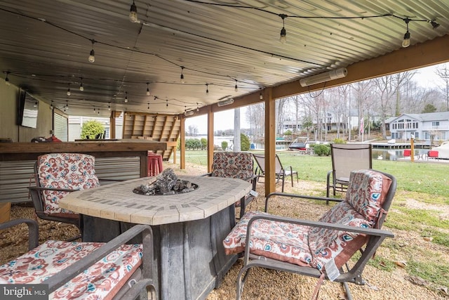view of patio / terrace with an outdoor fire pit