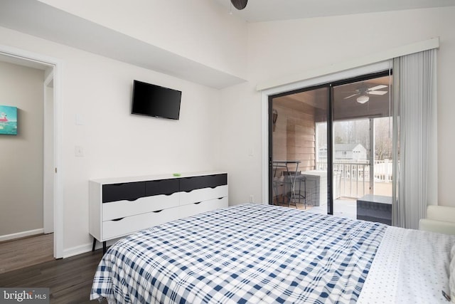 bedroom featuring dark wood-style flooring, access to exterior, and baseboards