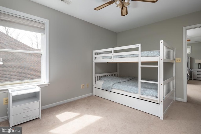 unfurnished bedroom with carpet flooring, baseboards, and ceiling fan