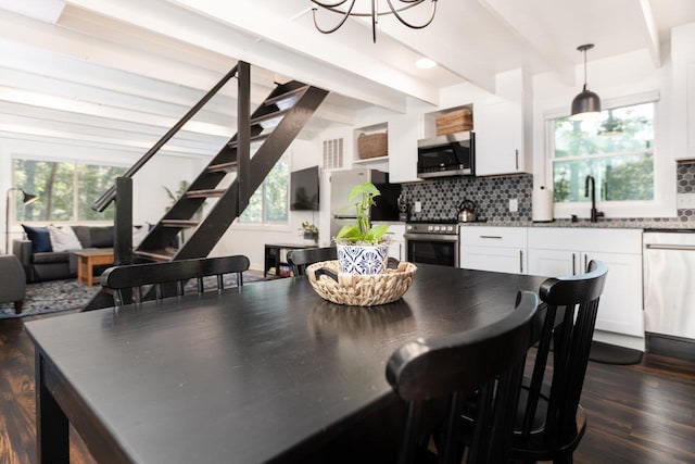 16184 Moonrise Ln, Broadway, VA 22815 - dining room with dark wood-style flooring, beam ceiling, stairs, and a chandelier