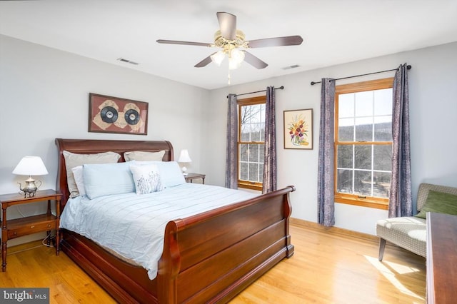 695 Whippoorwill Ln, Shipman, VA 22971 - bedroom with light wood-style flooring, multiple windows, and baseboards
