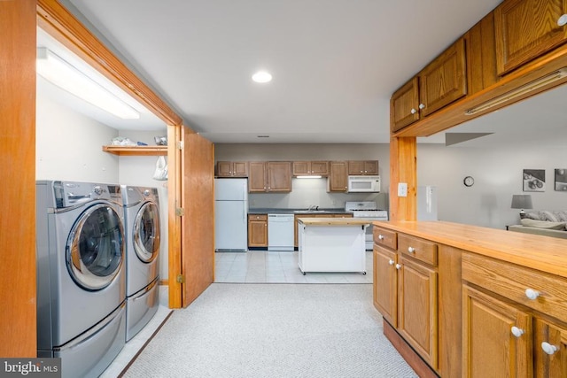 695 Whippoorwill Ln, Shipman, VA 22971 - kitchen featuring white appliances, washer and clothes dryer, wood counters, light carpet, and recessed lighting