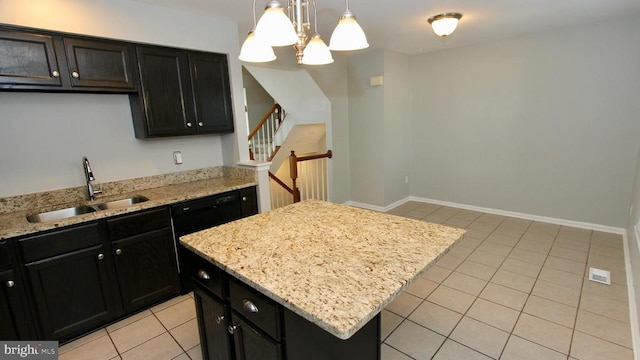 9600 Becker Ct, Fredericksburg, VA 22408 - kitchen featuring light tile patterned floors, a center island, a sink, a chandelier, and dark cabinetry
