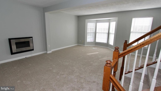 9600 Becker Ct, Fredericksburg, VA 22408 - unfurnished living room with stairway, a fireplace, carpet, and baseboards