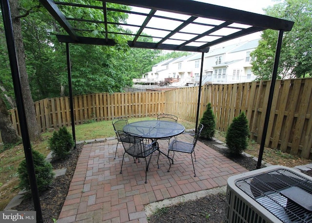 9600 Becker Ct, Fredericksburg, VA 22408 - view of patio with central air condition unit, outdoor dining area, a pergola, and a fenced backyard