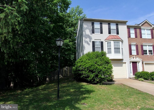 9600 Becker Ct, Fredericksburg, VA 22408 - townhome / multi-family property with a front lawn, driveway, a garage, and fence